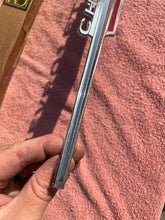 Load image into Gallery viewer, 1962 Chevrolet Chevy II 2 Nova 4 6 300 Standard NOS Hood Lip Emblem #3792812