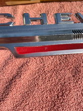 Load image into Gallery viewer, 1962 Chevrolet Chevy II 2 Nova 4 6 300 Standard NOS Hood Lip Emblem #3792812