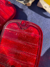 Load image into Gallery viewer, 1960-1966 Chevrolet Fleetside Pickup Truck NOS Tail Light Lamp Lens + Bezel Pair #5952677 / 3763570