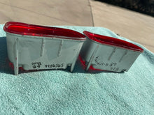 Load image into Gallery viewer, 1968 Chevrolet Bel-Air Impala NOS Tail Light (w/ Backup) Lamp Lens Pair (CHIPPED TAB) #5959866