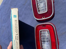 Load image into Gallery viewer, 1971 -  1973 Chevrolet Vega Coupe NOS GUIDE Backup Light Lamp Lens Pair #5966018
