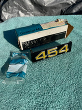 Load image into Gallery viewer, 1975 1976 Chevrolet Pickup Truck C10 C20 C30 NOS "454" Grille Emblem #357286 (cast 343992)