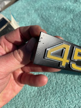 Load image into Gallery viewer, 1975 1976 Chevrolet Pickup Truck C10 C20 C30 NOS "454" Grille Emblem #357286 (cast 343992)