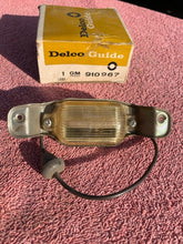 Load image into Gallery viewer, 1966-1971 Chevrolet NOS Delco GUIDE License Plate Lamp Lens Assembly #910967