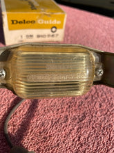 Load image into Gallery viewer, 1966-1971 Chevrolet NOS Delco GUIDE License Plate Lamp Lens Assembly #910967