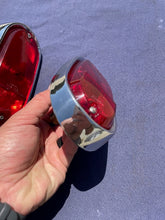 Load image into Gallery viewer, 1955-1959 Chevrolet Suburban Panel Truck USED Tail Light Lamp Lens + Bezel Pair #5952787 / 5946391
