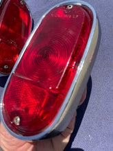 Load image into Gallery viewer, 1955-1959 Chevrolet Suburban Panel Truck USED Tail Light Lamp Lens + Bezel Pair #5952787 / 5946391
