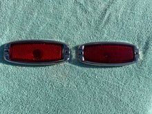 Load image into Gallery viewer, 1941 - 1948 Chevrolet Fleetline 4-door sedan NOS Guide Tail Light Lamp Lenses / Bezels #5930829/5930830
