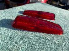 Load image into Gallery viewer, 1941 - 1948 Chevrolet Fleetline 4-door sedan NOS Guide Tail Light Lamp Lenses / Bezels #5930829/5930830
