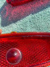 Load image into Gallery viewer, 1941 - 1948 Chevrolet Fleetline 4-door sedan NOS Guide Tail Light Lamp Lenses / Bezels #5930829/5930830
