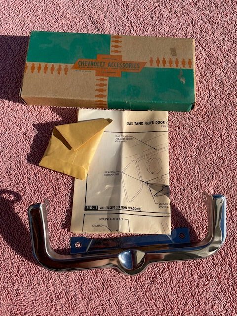 1963-1964 Chevrolet STATION WAGON NOS Accessory Gas Door Guard #985489