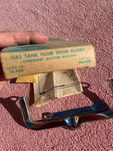 Load image into Gallery viewer, 1963-1964 Chevrolet STATION WAGON NOS Accessory Gas Door Guard #985489
