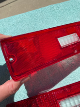 Load image into Gallery viewer, 1970 1971 Chevrolet Nova SS NOS Tail Light Lamp Lens Pair #5964171 / 5964172
